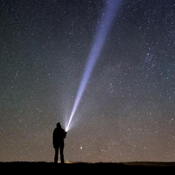 man staring at the stars