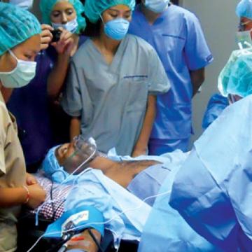 Medical procedure in Natuvu Creek in Fiji - Pepperdine Magazine