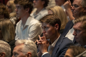 An audience member focusing on the talk