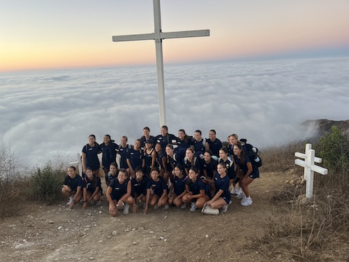 The women's soccer team at the cross