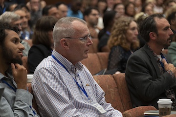 Faculty members listening