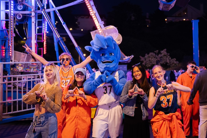 Pepperdine students and Willie the Wave enjoy Waves Weekend