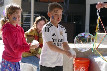 Children playing with bubbles