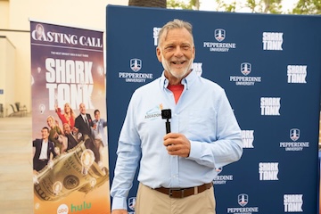 A man speaking into a microphone