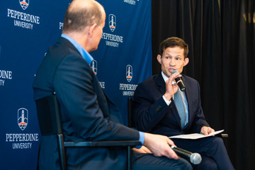 Tanner Gardner speaks with President Jim Gash