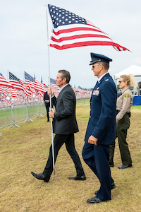 Quaid preparing to plant the final flag