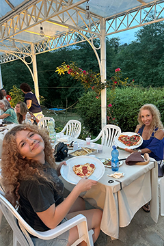 Alumni with their homemade pizza