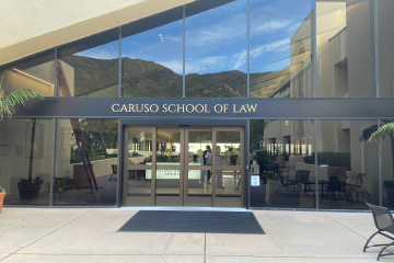 Automated doors on the Caruso School of Law building.
