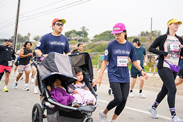 Couple running with their family