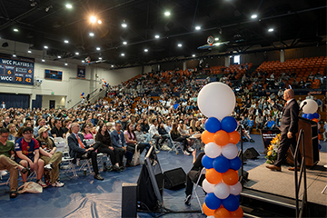 Gash speaking with attendees 