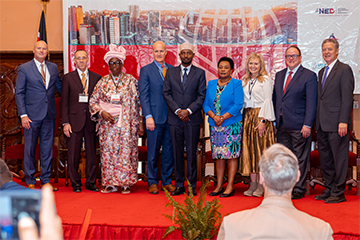 Danny DeWalt, Jim Gash, and others posing at IRF Summit