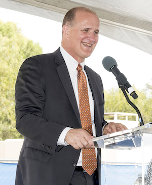 President Jim Gash speaking at the podium at the Mountain groundbreaking