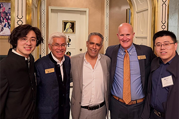 Hung Le and president Jim Gash with alumni