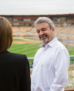 Ned Colletti talks with student during Dodgers spring training
