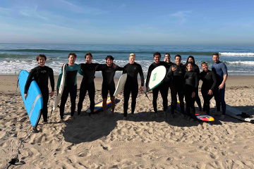 Ricky (middle) surfing with PeppVets in March