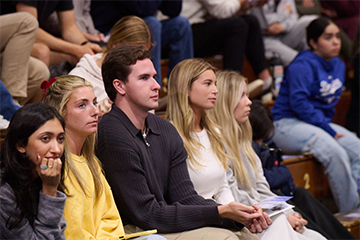 Students in the Firestone Fieldhouse audience