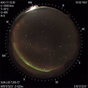 Restored image of an aurora (bottom left) from the Kjell Henriksen Observatory