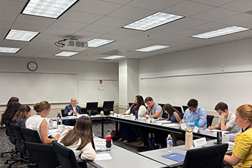 Dr. Guy Burnett leads a Colloquy discussion group