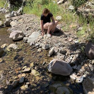 Seaver College student conducting research by a stream in the Santa Monica Mountains