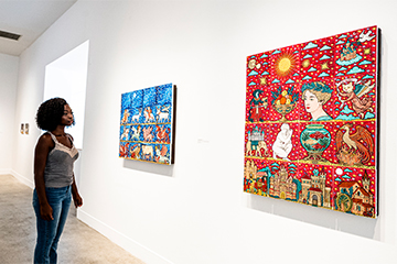A student admiring the exhibition
