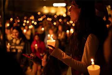 Students singing by candlelight 