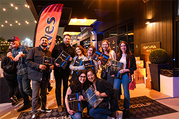 Alumni posing for photo at Topgolf event