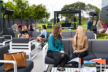 Alumni Helen Winter and Veronica Basadre at Topgolf event