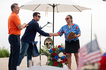 Eric Leshinsky presenting Natalie Trogus with award