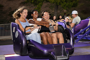 Pepperdine students on a carnival ride at Waves Weekend 2023.