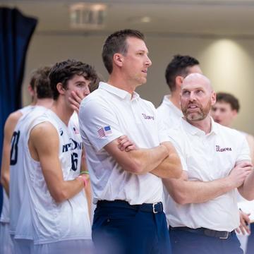 Jonathan Winder talking with a fellow coach