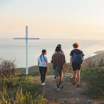 Students hiking to the cross