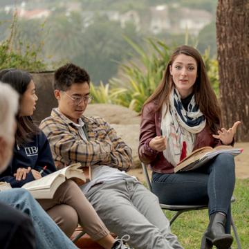 Students discussing a book