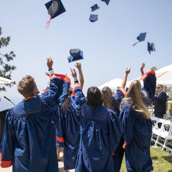 Graduating students throwing caps in the air