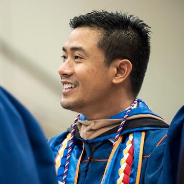 Student wearing military honor cords at commencement