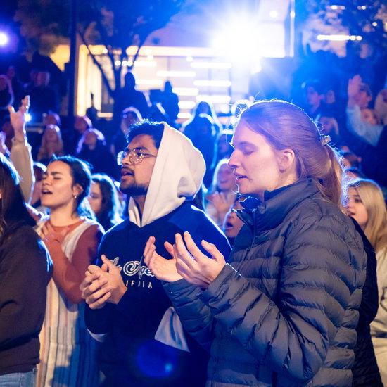 Students praying at The Well