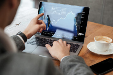 financial graphs on laptop