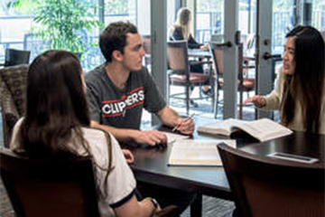 people talking at a table
