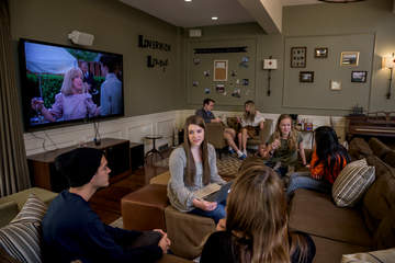Students gathered in a dorm common room