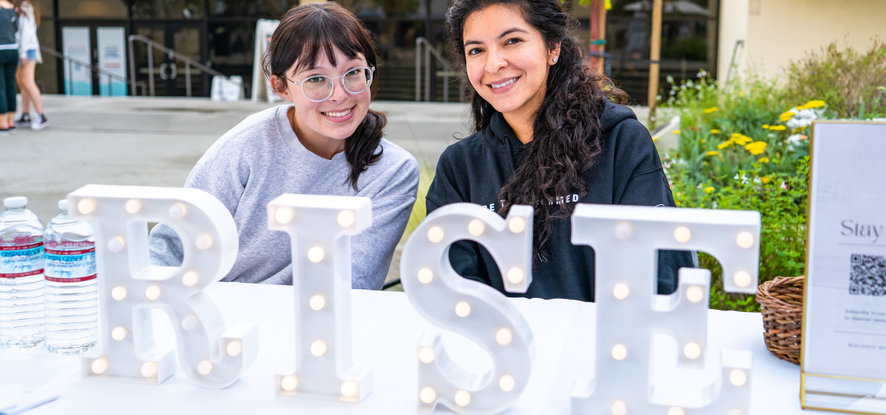 Students manning the RISE table