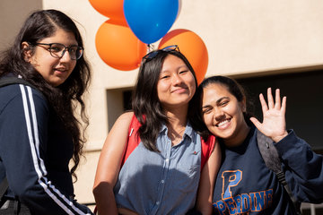 Students smiling at a RISE event