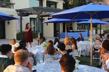 Speaker presenting outside