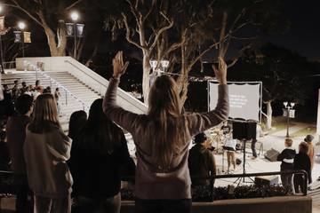 Students worshiping at the amphitheater 