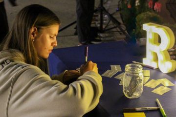 Student writing a note of reflection