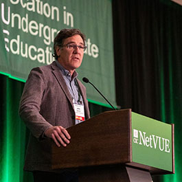 John Barton speaking at potium