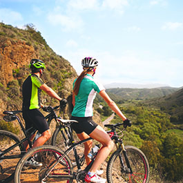 two people mountain biking