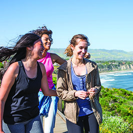 ladies walking with ocean view