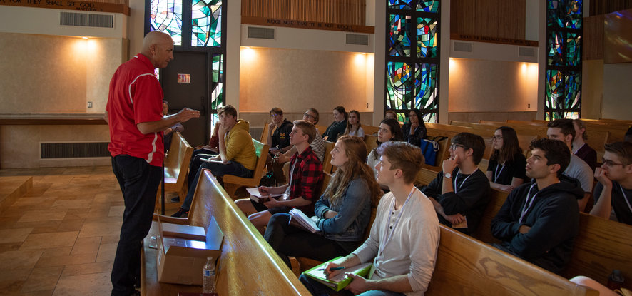 Students in pews listening in Stauffer Chapel