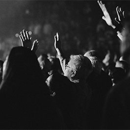 Black and white photo of students worshipping