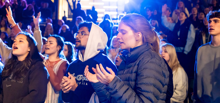 Students worshipping in the evening