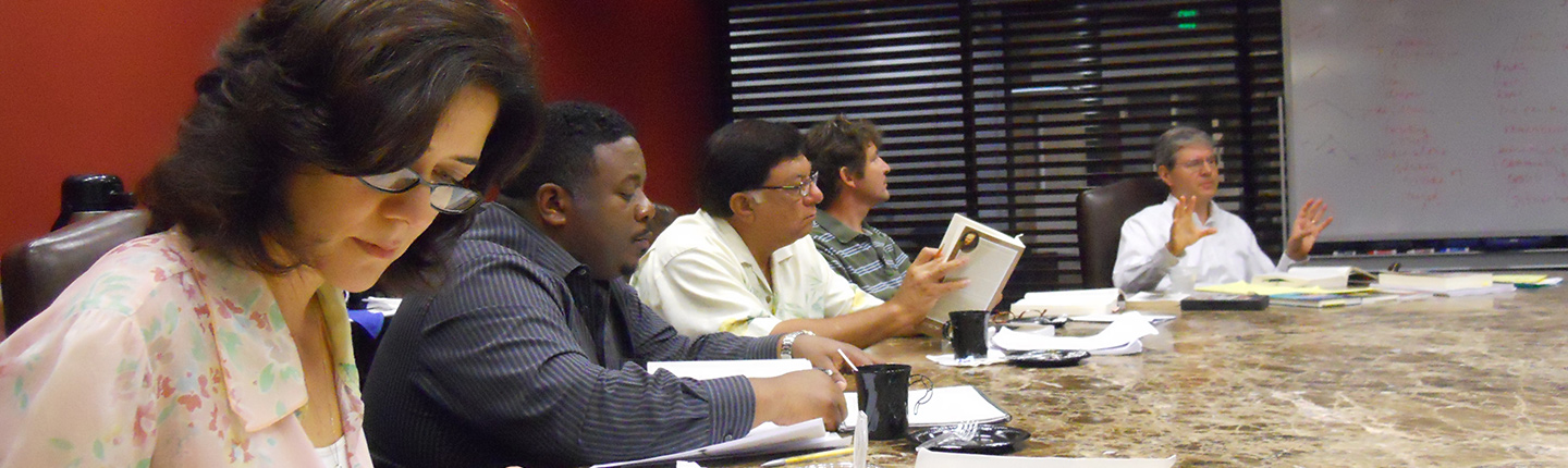 Barton leads a discussion at a table